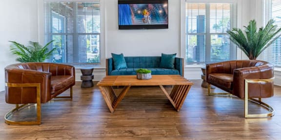 a living room with a blue couch and a coffee table