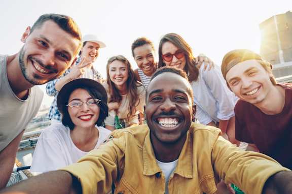 A group of people are taking a selfie together.