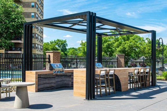 a bar with chairs and a table under a canopy at Parkview Towers, Collingswood, NJ, 08107