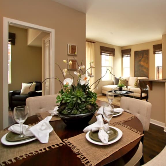 a kitchen and dining room with a table and chairs
