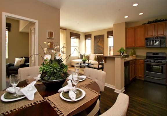 a kitchen and dining room with a table and chairs