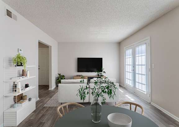 a living room with couches and chairs and a table