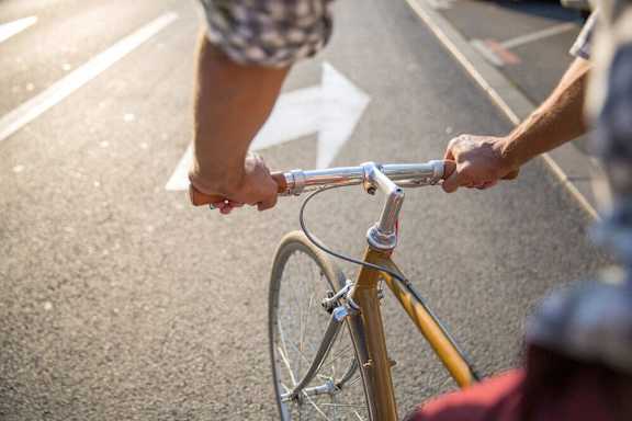 a person is riding a bike on the street