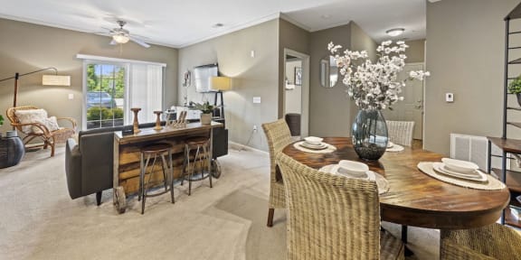 dining area and living room with nnodel furnishings and decor in Fenwyck Manor model apartment