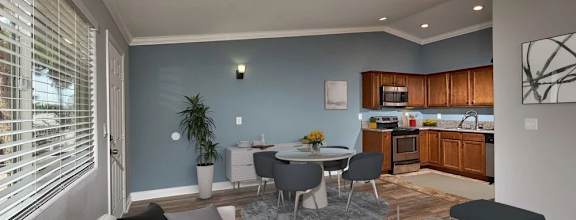 view fo living room with couches with dining area in background
