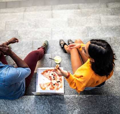 Couple eating pizza at The Villas at Villas at Bailey Ranch Apartments, Owasso, Oklahoma