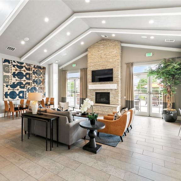 a kitchen with a counter top and a table with chairs