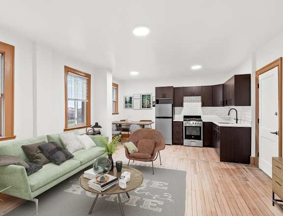 A living room with a green couch and a coffee table.