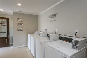 The Slate at Ninety Six - Coin Operated Washer and Dryer With Wooden Door and Wall Decorations