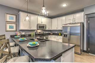 Counter top seating and view of the kitchen at The Helen