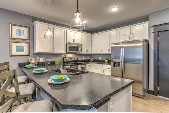 Counter top seating and view of the kitchen at The Helen