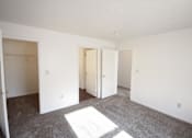 Thumbnail 10 of 16 - an empty bedroom with white walls and carpet