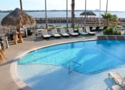 Thumbnail 11 of 19 - Pool with lounge chairs and view of