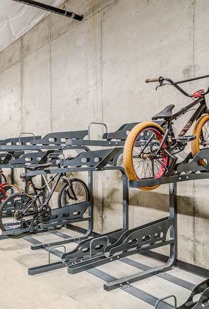 A bike rack with many bikes parked in it.