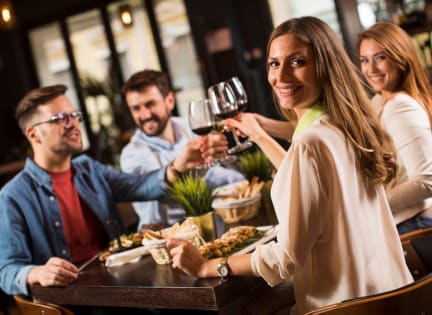 people drinking wine at a restaurant