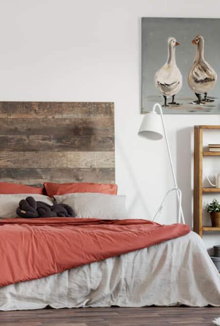 a bedroom with a bed and a bookcase