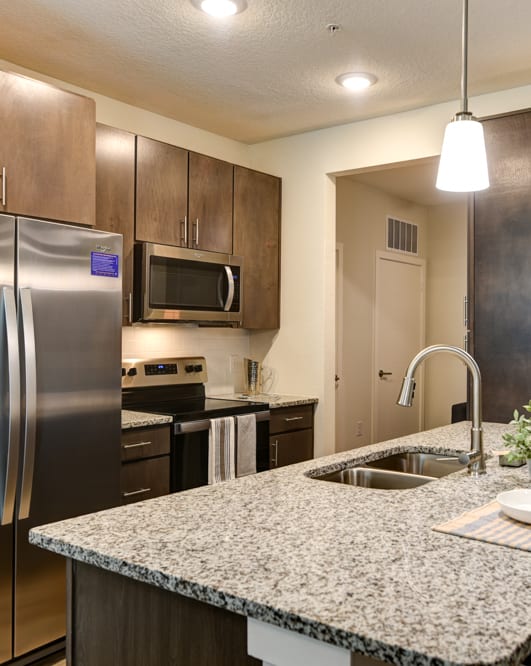 Kitchen with Granite Countertops at Fusion Apartments in Jacksonville, FL 32256