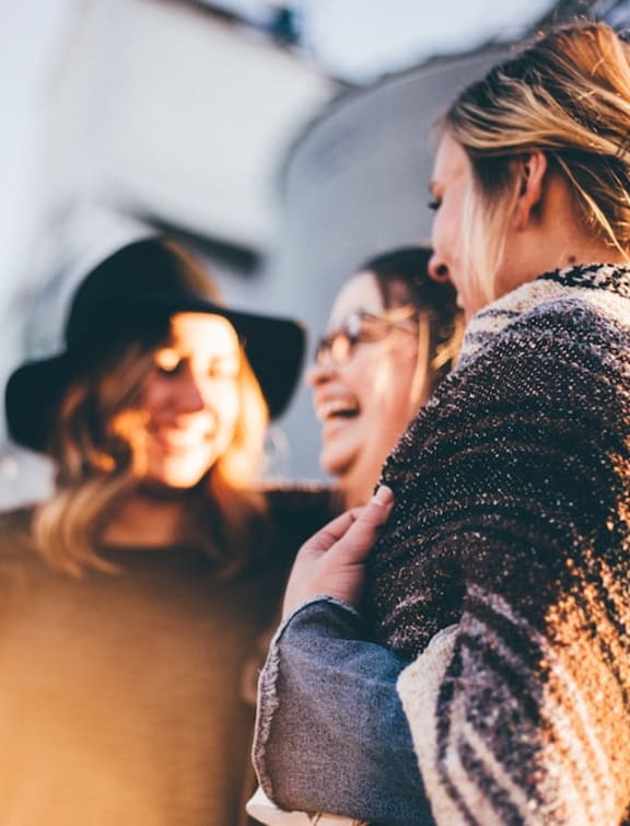 a group of women standing next to each other