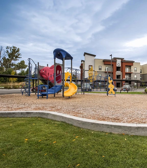 a playground at the enclave at woodbridge apartments in sugar land, tx