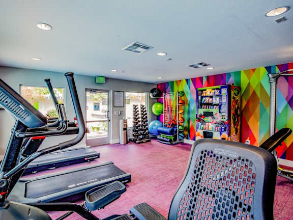 Fusion Las Vegas fitness center with colorful geometric mural on the wall