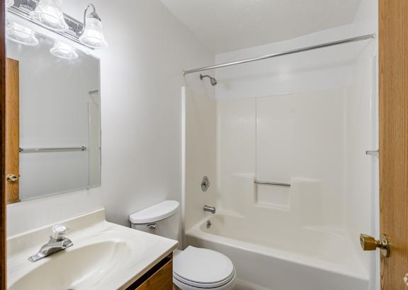 a bathroom with a toilet sink and bathtub