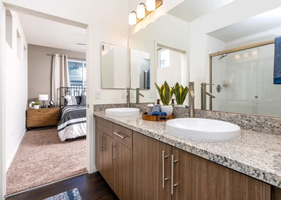stylish bathrooms with modern cabinets and sinks at Miro at the Parc, Henderson
