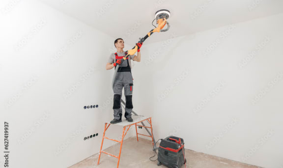 a man standing on a ladder and holding a chainsaw