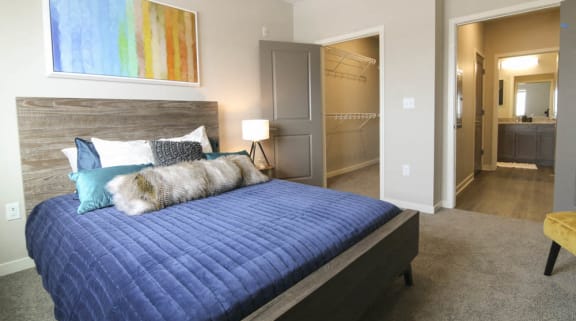 Bedroom with walk-in closet at WH Flats new luxury apartments in south Lincoln NE 68516