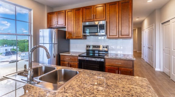 a kitchen with granite counter tops and a sink
