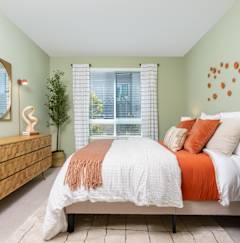 A Bedroom With Dresser And Mirror at North Grove, Riverside, CA