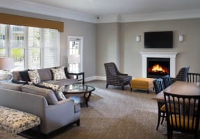 a living room filled with furniture and a fire place
