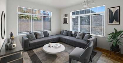 Model Living Room with Wood-Style Flooring and Window View at Altitude on Fifth Apartments in Salt Lake City, UT.
