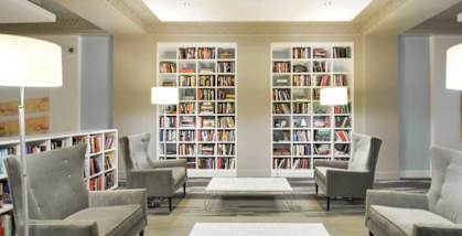 a large library with a lot of books at 1841 Columbia Road Apartments, Washington, Washington DC