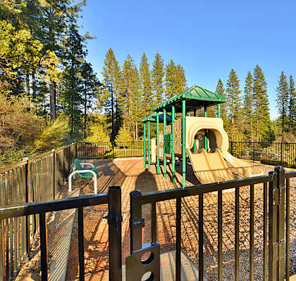 a playground with a slide in a park