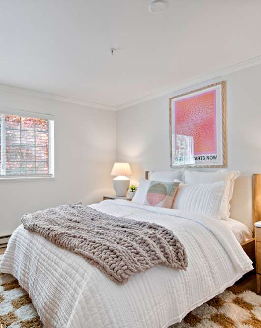 a bedroom with a bed and a dresser and a window at Lakemont Orchard, Issaquah