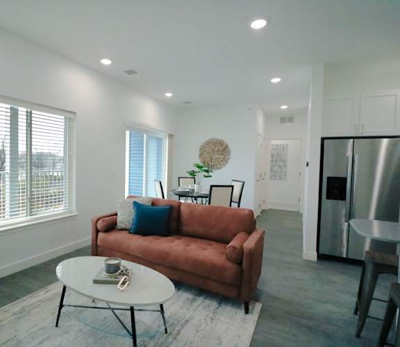 a living room with a couch and a table