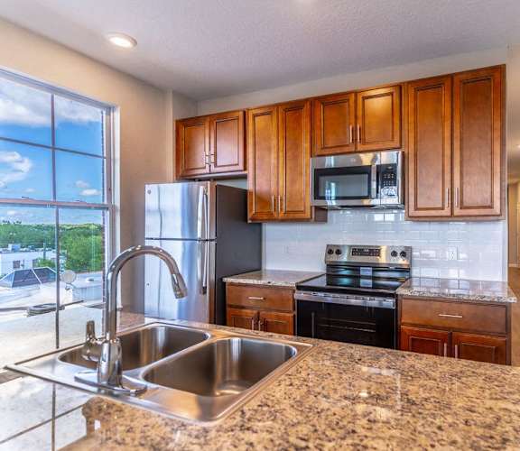 a kitchen with granite counter tops and a sink