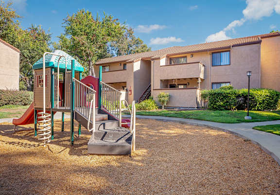 our apartments have a playground with a slide and playset