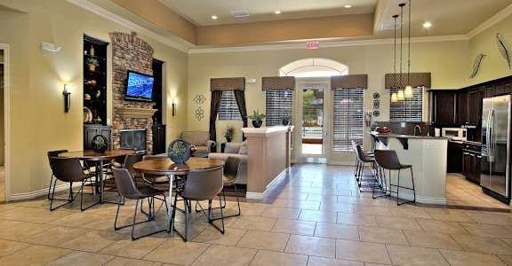 a large kitchen and dining room with a table and chairs