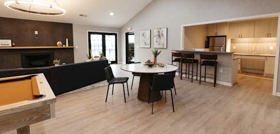 a large living room with a dining area and a kitchen