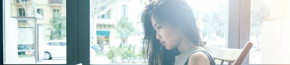 Woman Studying in Coffee Shop