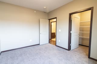 Bedroom with attached walk in closet at 360 at Jordan West