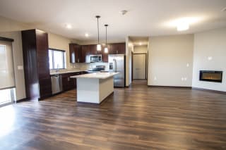 Living room and kitchen space at 360 at Jordan West