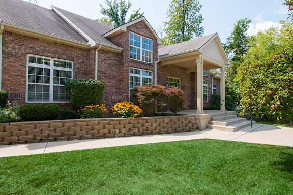 A house with a brick facade and a white roof.