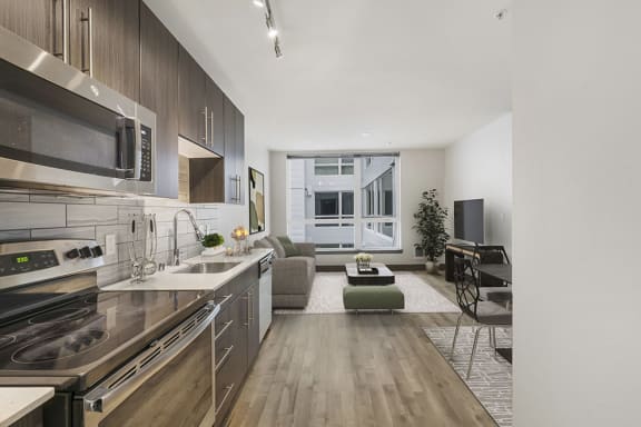 a kitchen and living room in a 555 waverly unit