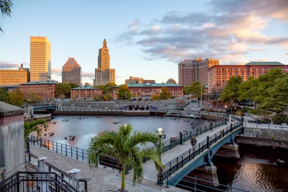 a cityscape with a bridge over a body of water