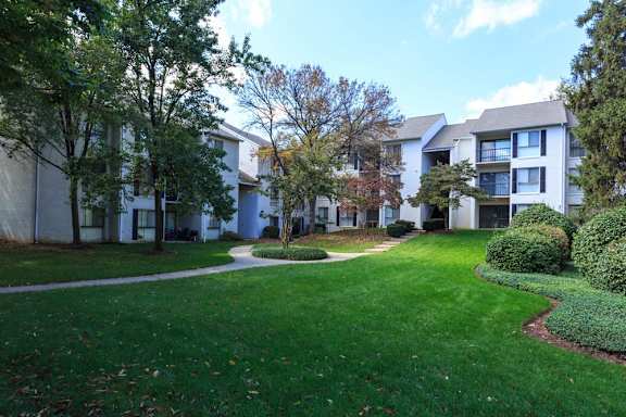 Apartment exterior with trees at The Residences at the Manor Apartments, Frederick, Maryland