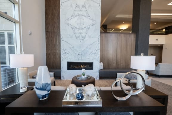 a living room with a fireplace and a coffee table