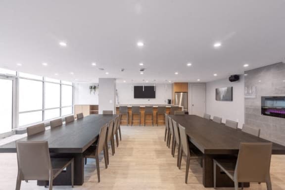 a conference room with a long table and chairs