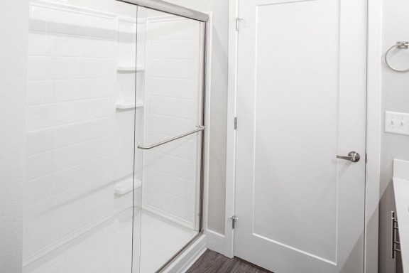 Baseline 158 - Walk-in shower with glass enclosure in select units